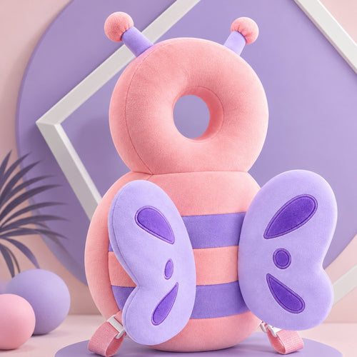 Bibbito Head Cushion in the Pink Bee design, a soft pink plush bee cushion with purple wings and backpack-style straps